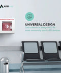 AdirMed white wall-mounted AED cabinet with red defibrillator inside; waiting area with gray chairs