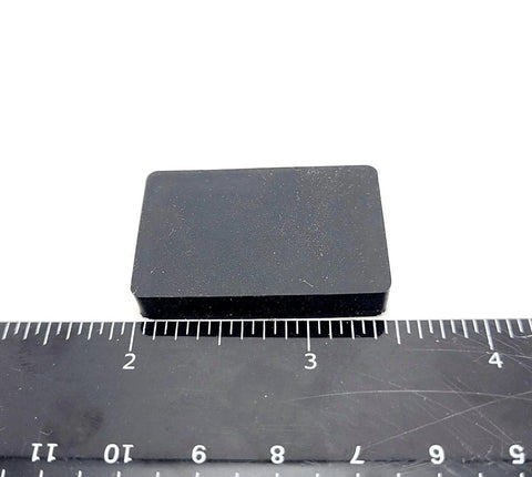 Rectangle Silicone Rubber Bumper Feet One And One Half Inch By One Inch Three Sixteenth Inch Thick shown with ruler