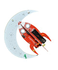 Spaceship Kit STEM Project Learn How To Solder Beginner Friendly Electronics Set With Tools Included For Teens 12 Plus And Adults To Build Real Circuits And Show Off Your Soldering Skills. red rocket circuit board on crescent moon