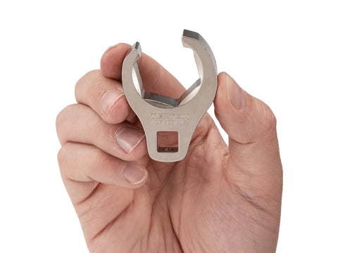 Hand holding 3/8 Inch Drive To 1-1/16 Inch 6 Point Flare Nut Crowfoot Wrench WCF15227 for tight spaces, silver metal finish.