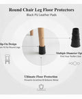 Round chair leg protectors with black PU leather slip on floor guards for hardwood surfaces, shown on a wooden chair leg.