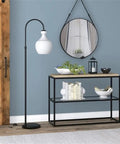 Dope Arc Floor Lamp With Glass Shade In Blackened Bronze And White Milk Glass Modern Standing Lamp in a living room setting