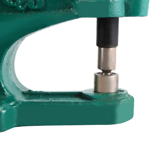 Close-up of Grommet Eyelet Hand Press Tool With Interchangeable Dies, Portable Manual Banner Punch showing metal dies in green frame.