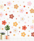 128 Pcs Colorful Flower Wall Sticker Set With Groovy Retro Hippie Vibe Boho Daisy Decals In Three Sizes For Girls Teen Bedroom Dorm Decor Nursery Wall Art For Spring And Summer Aesthetic on walls with plants below