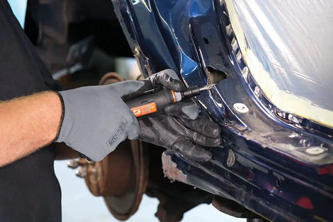 Nitro Series Straight Line Die Grinder Featuring 0.5 Horsepower Motor in use on metal, designed for precision trimming and smoothing.