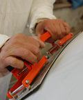 Person using Flexisander Hand Held Flexible Sanding Block for Curved and Flat Surfaces on automotive body