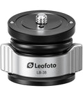 Slick Mini Leveling Half Ball Base With Buttery Smooth Ten Degree Tilt Adjustment Solid Cnc Aluminum Frame For Camera Gear Quarter Inch Mount Compatible With Standard Tripod Threads - Close up of black and silver circular base.