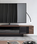 A TV setup showing a 4 Pack 1 Inch Wall Cable Pass Through Grommet in white on the wall for easy cable management and furniture hole cover.