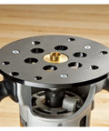 Solid As A Rock Metric Brass Router Guide Bushing Set on a router base for precise template tracking in woodworking.