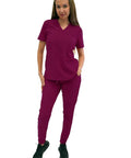 Women's Slim High Waisted Jogger Scrub Pants Yoga Style Nursing Uniforms Wine Color Buttery Soft Healthcare Workwear model standing