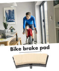 Universal Indoor Bike Brake Pads For Stationary Cycles in home setup, shown with exercise bike and study table.