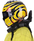 Person wearing 360 Plus Neck Collar for adults in go kart racing with yellow helmet, stabilizes head movement, durable nylon core.