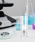 Sturdy Acrylic Mouse Restrainer Tube Fixture With Pretty Darn Secure Grip For Zero Fuss Abdominal And Tail Vein Injections Sweet Spot Lab Gear For Healthy Little Rodents Up To Thirty Five Grams Straightforward Equipment For Busy Labs on lab table with experiment equipment.