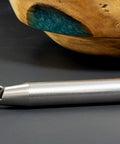 Carbide-tipped woodturning tool with 17-inch silver metal handle; side view with replaceable tip.