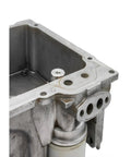 Billet Aluminum LS Oil Pressure Relief Valve Plug Machined For Knockout Engine Blocks And LS Swap Builds in engine block close-up.