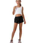 Girl wearing Girls Athletic Shorts With Liner Quick Dry Lightweight Running Shorts For Active Workouts Built In Mesh Liner Black Size S