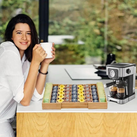 Woman enjoying coffee beside an expandable bamboo K Cup holder drawer organizer for coffee pods and tea bags