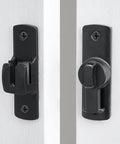 Close-up of 90 and 180 degree flip barn door lock for privacy and security, adjustable latch hardware installed on a white door.