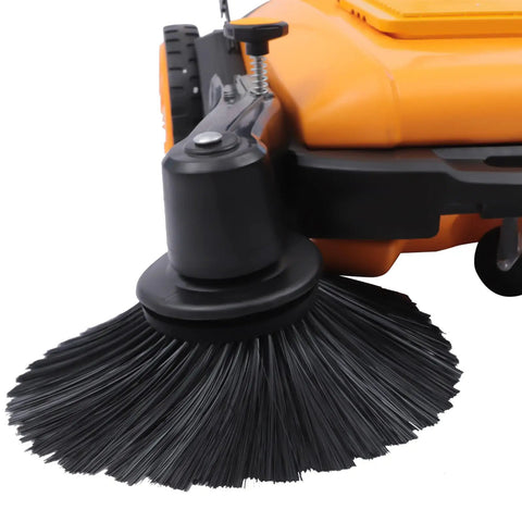 Close-up of the side brush on the Badass Heavy Duty Walk Behind Push Sweeper With A Wide Forty One Inch Brush And Spacious Dust Bin.