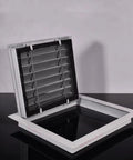 24 X 24 Inch Attic Access Panel And Drywall Vent Cover With Heavy Duty Louvered Grille opened view showcasing the louvered grille.
