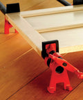 Close-up of a Half Inch H Style Pipe Clamp with clutch disc, acme threaded spindle, and high base on wooden surface for woodworking.