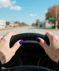 Hands with Eggplant Purple Gel Nail Polish 0.5 Fl Oz Soak Off UV LED Safe Formula holding a steering wheel
