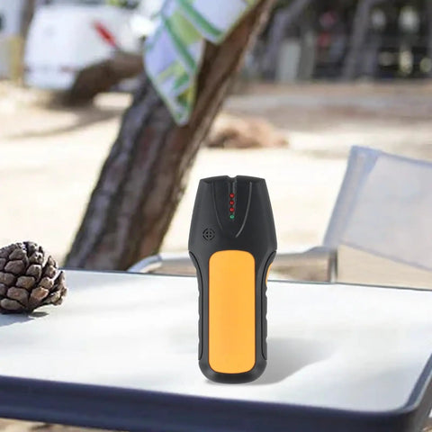 3-in-1 Wall Scanner Stud Finder for Wood Metal and Live Wire Detection, Electronic Sensor Detector for Pipe AC Cable Home Renovation DIY Projects on a table outdoors.