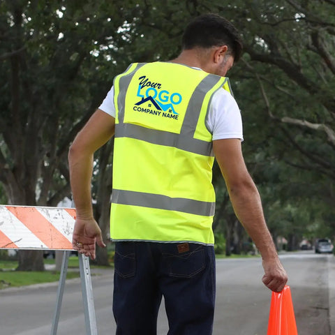 Custom Printed High Visibility Safety Vest In Vivid Yellow With Reflective Striping For Road Crews And Construction Teams Hella Bright Job Site Workwear Size X Large, worn by a man, showing back and logo
