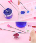 Must-Have 11 Pcs Resin Tools Kit With Stirrers Spoons Poke Needles Anti-Static Tweezers And Pipette For Resin Art Jewelry Making Epoxy Casting DIY Crafts Rose Red in use to mix resin and glitter details in molds.