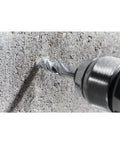 Masonry drill bit, 3/4 in x 4 in x 6 in, steel, fast-spiral, in drill against concrete wall