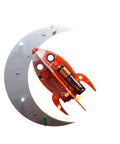 Spaceship Kit STEM Project Learn How To Solder Beginner Friendly Electronics Set With Tools Included For Teens 12 Plus And Adults To Build Real Circuits And Show Off Your Soldering Skills. red and gray spaceship-shaped solder kit with 9V battery