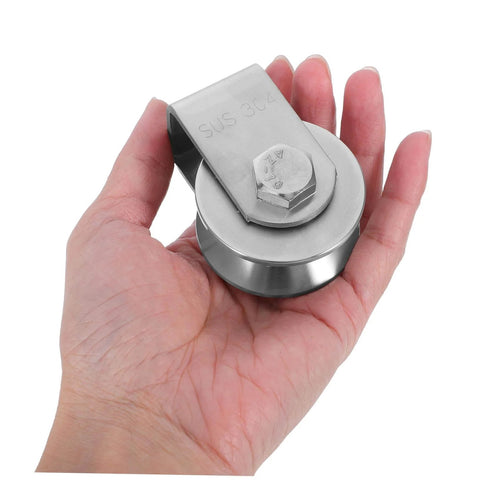 Hand holding Stainless Steel Fixed Pulley Bearing For Sliding Doors And Gates, Heavy Duty Wall Mounted Pulley System with Smooth Grooves.