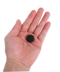 Close-up of a hand holding a black snap rivet from the 12 Set Car Roof Headliner Repair Kit With Black Snap Rivets Retainers For Easy Interior Ceiling Fixing No Disassembly Required Quick And Durable For A Clean Seamless Interior Look Easy DIY Fix Fits Most Cars Durable Snap Rivets And Retainers.