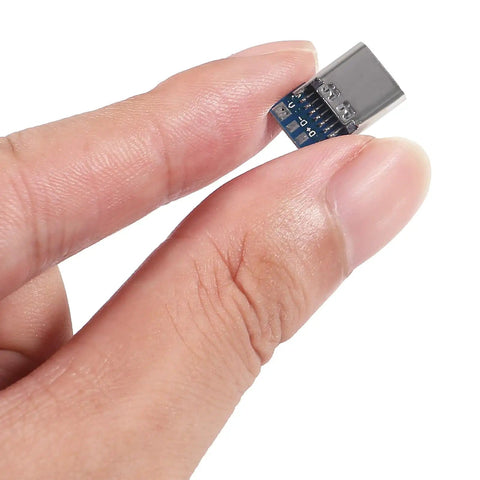 Close-up of fingers holding Usb C Connector Kit With 40 Pin Breakout Board USB 3.1 Type C Female Socket.
