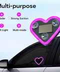 Heart Shaped Car LED Ambient Light With Solar Rechargeable Power attached to car window, showing suction cups and solar panel.