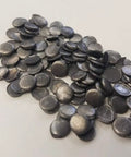 Top Shelf Nine Nine Point Nine Pure Lead Plugs And Discs For Screw Penetrations On Radiation Shielding Walls And Sound Deadening Builds Five Sixteenths Inch Diameter By Eighth Inch Thick 100 Piece Pack, close-up of multiple lead plugs.