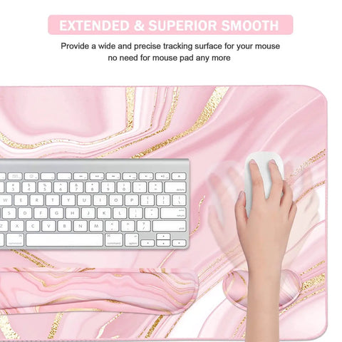 Close-up view of Large Extended Keyboard And Mouse Pad Set With Memory Foam Wrist Rests For Ergonomic Typing Ultra Smooth Desk Pad 3 Piece Pink Gold For Home Office Study And Gaming showcasing a keyboard and hand on mouse