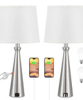 Set Of 2 Modern Table Lamps For Living Room And Bedroom With USB C And USB A Charging Ports Dimmable Touch Bedside Lamps With White Fabric Shade Nickel Finish Ideal For Master Or Guest Rooms End Table Lighting. Display of two lamps with charging phones and bulbs.