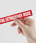 Fire Extinguisher Inside Sign 4 Pack 12x2 Inches Self Adhesive Vinyl Floor Decals held by hand, shown in bright red.