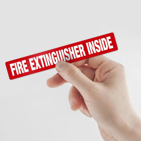 Fire Extinguisher Inside Sign 4 Pack 12x2 Inches Self Adhesive Vinyl Floor Decals held by hand, shown in bright red.