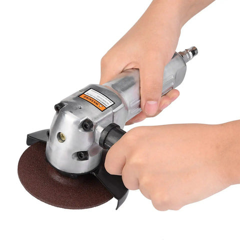 Heavy Duty Pneumatic Angle Grinder With Rock Solid 100mm Sanding Pad Delivers 11000rpm in use for deburring metal.