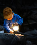 Child exploring with 600 Lumen Multi Functional Go To Camping Lantern With USB Charging For Phones And Small Devices Solar Recharge