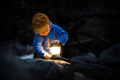 Child exploring with 600 Lumen Multi Functional Go To Camping Lantern With USB Charging For Phones And Small Devices Solar Recharge