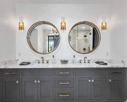 Modern bathroom featuring two Brushed Gold Wall Sconce With Clear Glass Cylinder Shade 1 Light Modern Transitional Wall Light Fixture