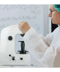 Built Like A Tank Rockwell Hardness Tester Machine Featuring Superficial Scales HRC HRA HRB And Solid Calibration Blocks For Heat Treated Steel And Soft Metals Up To 150 Kg being operated by a person in a lab coat.
