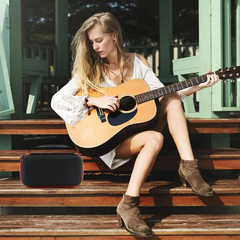 Woman playing guitar next to Durable Oxford Microphone Case For JBL Wireless Two Mic System Grab And Go Mic Storage Portable Box Color A.