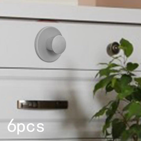 Stick-On Cabinet Pulls 6 Pack, Self-Adhesive Knob on white drawer, Modern Gray PP Material for quick no-drill install