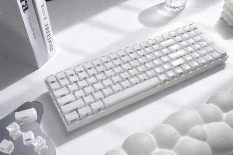 Wireless Mechanical Keyboard With Number Pad And Dynamic RGB Lighting Featuring Playful Jelly Cat Keycaps And Buttery Smooth Linear Switches For Your Dope Desk Setup Or Epic PC Gaming Nights, showcasing white keycaps on a smooth surface.