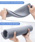 Hands holding flexible Beefy Silicone Heat Press Mat 16x20 Inch Heavy Duty Double Sided Pad For HTV Heat Transfer Vinyl, 0.34 Inch Thick