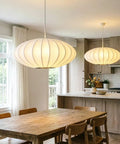 AFSEMOS 20" Japanese Wabi Sabi Pendant Light Silk Hanging Lantern Lamp above a wooden dining table in a bright kitchen.
